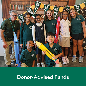 Students posing for a photo. Links to Donor-Advised Funds